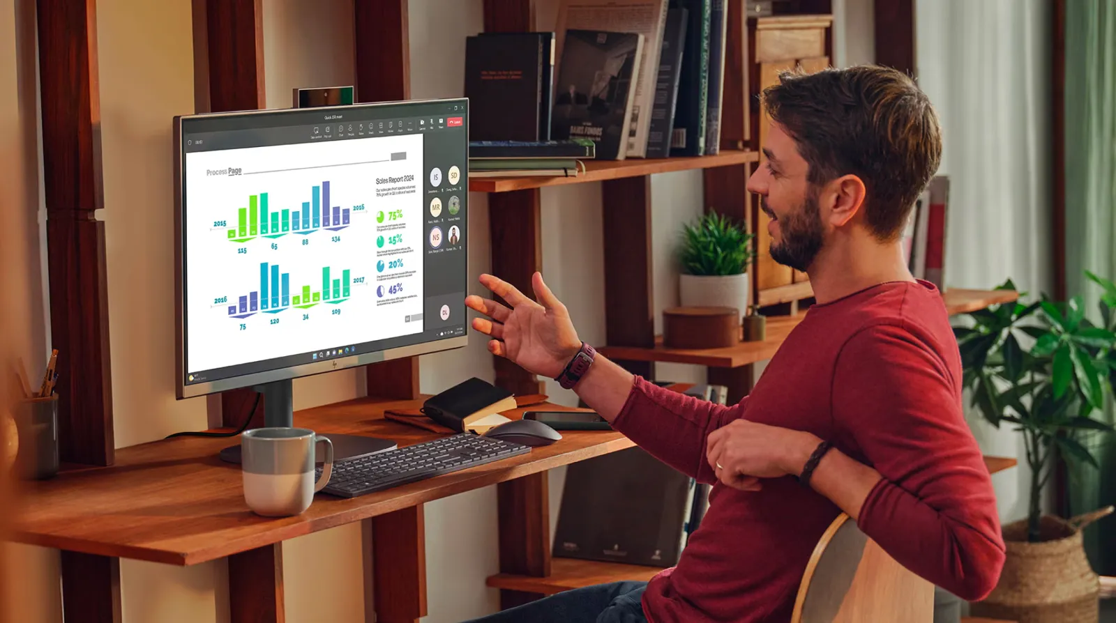 Person working at a slim all-in-one PC at home